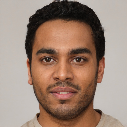 Neutral latino young-adult male with short  black hair and brown eyes