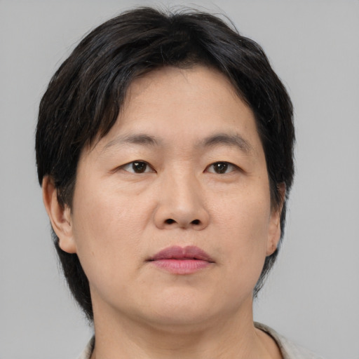 Neutral asian adult male with medium  brown hair and brown eyes