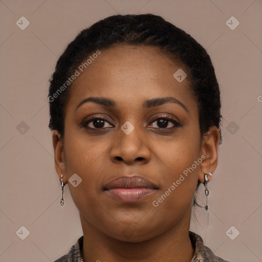Joyful black young-adult female with short  black hair and brown eyes