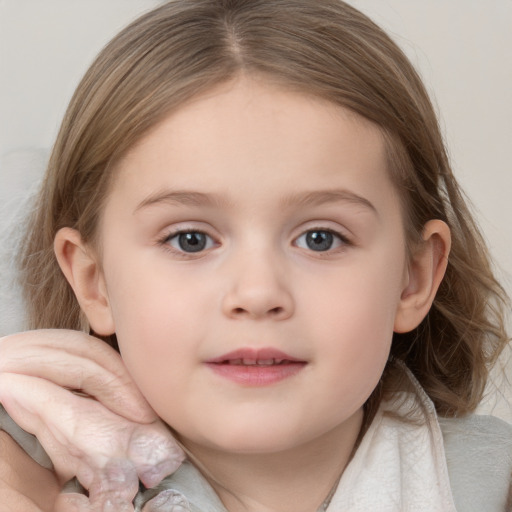 Joyful white child female with medium  brown hair and blue eyes