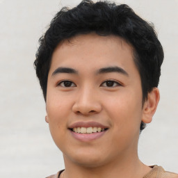 Joyful asian young-adult male with short  black hair and brown eyes