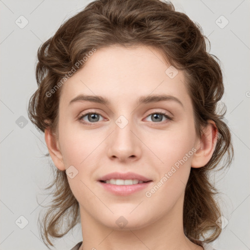 Joyful white young-adult female with medium  brown hair and green eyes