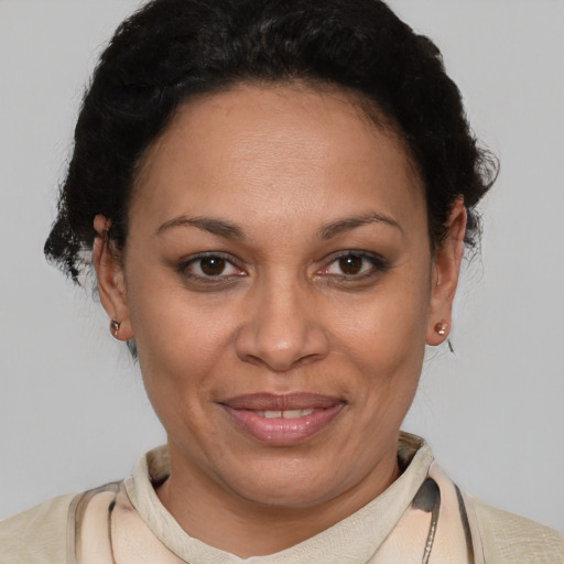 Joyful latino adult female with short  brown hair and brown eyes