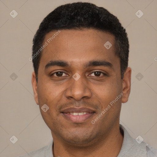 Joyful black young-adult male with short  black hair and brown eyes