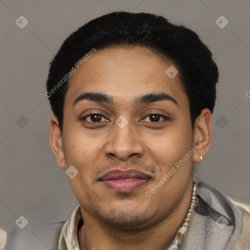 Joyful latino young-adult male with short  black hair and brown eyes