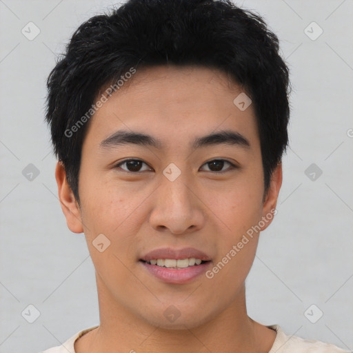 Joyful asian young-adult male with short  black hair and brown eyes