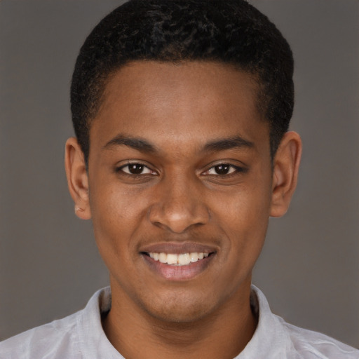 Joyful latino young-adult male with short  brown hair and brown eyes