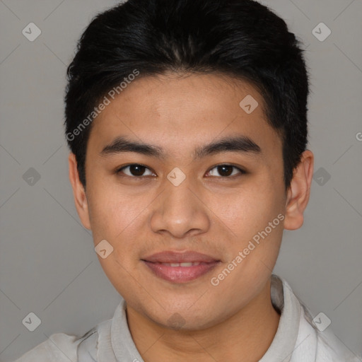 Joyful latino young-adult male with short  brown hair and brown eyes