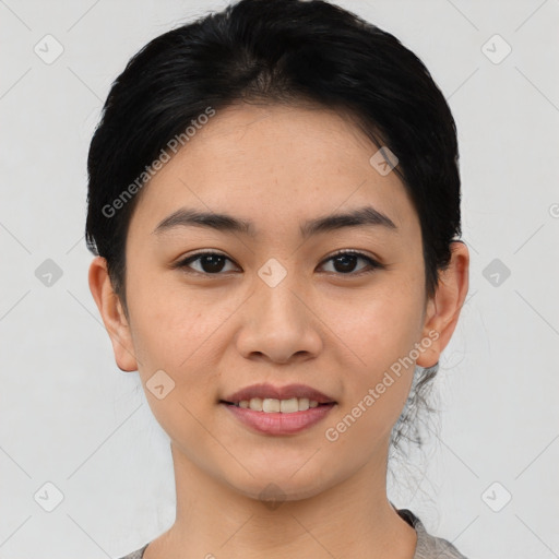 Joyful asian young-adult female with short  black hair and brown eyes