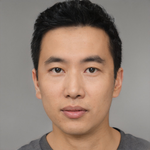 Neutral asian young-adult male with short  black hair and brown eyes