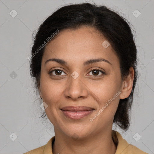 Joyful latino adult female with medium  brown hair and brown eyes