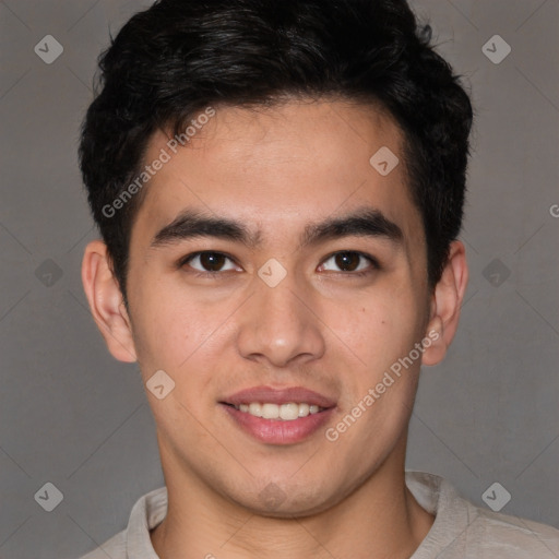 Joyful latino young-adult male with short  brown hair and brown eyes