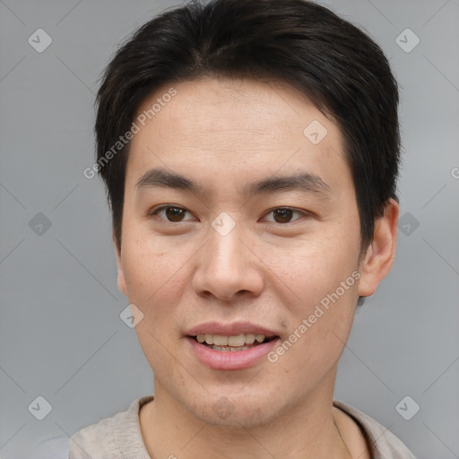 Joyful asian young-adult male with short  brown hair and brown eyes