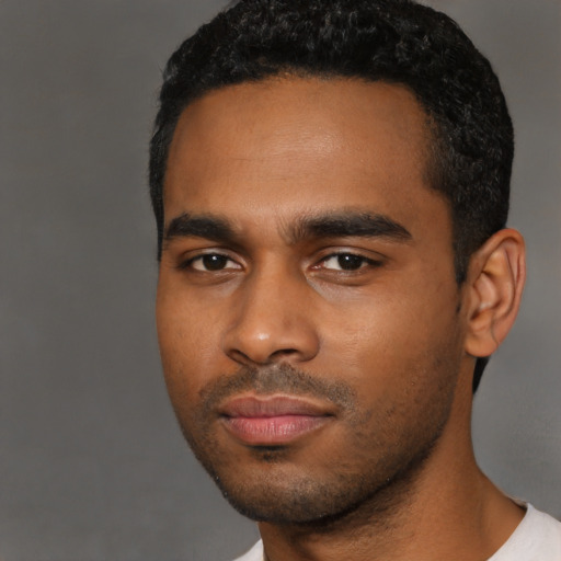 Neutral black young-adult male with short  black hair and brown eyes