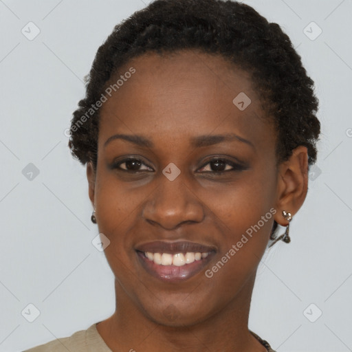 Joyful black young-adult female with short  brown hair and brown eyes