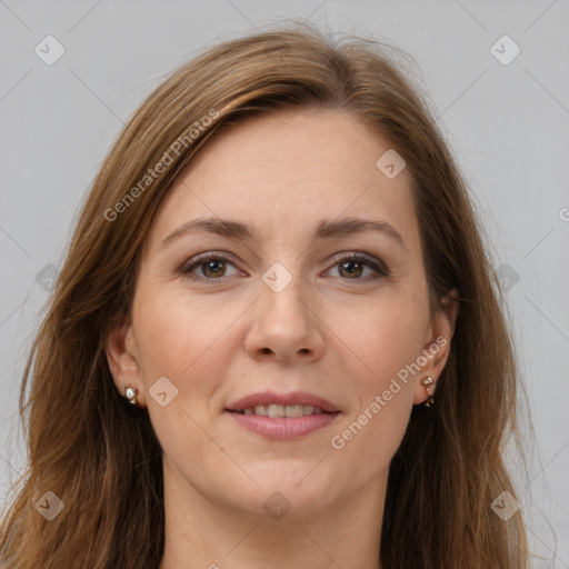 Joyful white adult female with long  brown hair and brown eyes