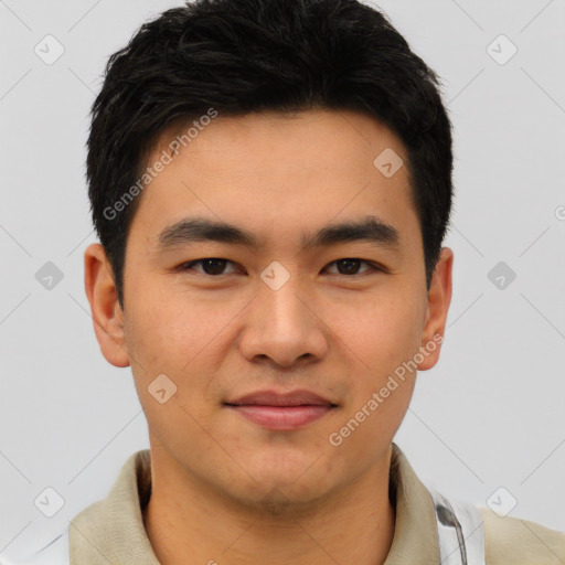 Joyful asian young-adult male with short  black hair and brown eyes