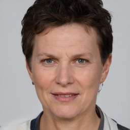 Joyful white adult female with short  brown hair and brown eyes