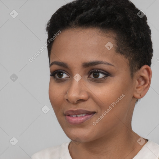 Joyful black young-adult female with short  black hair and brown eyes