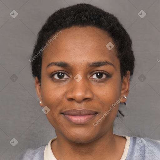 Joyful black young-adult female with short  black hair and brown eyes