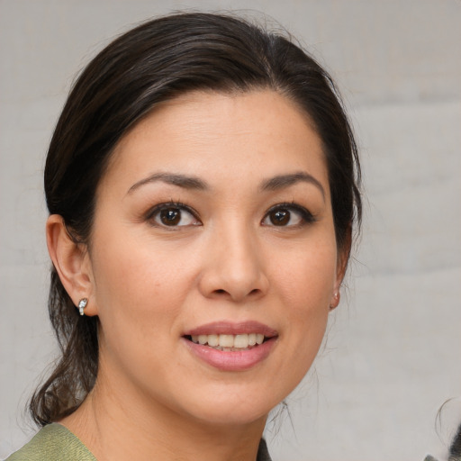 Joyful white young-adult female with medium  brown hair and brown eyes