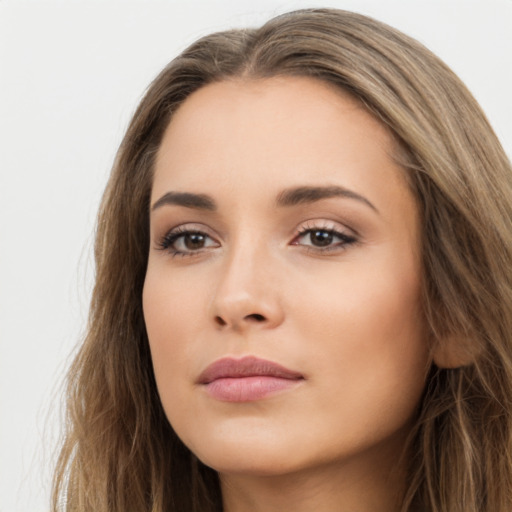 Neutral white young-adult female with long  brown hair and brown eyes