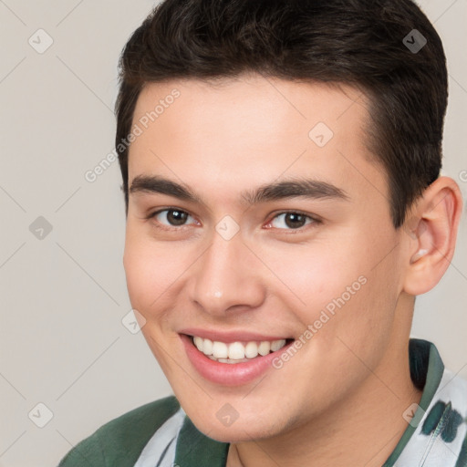 Joyful white young-adult male with short  brown hair and brown eyes