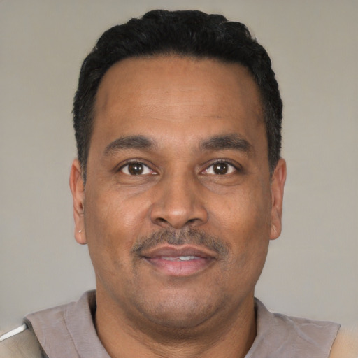 Neutral latino adult male with short  black hair and brown eyes