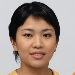 Joyful asian young-adult female with medium  black hair and brown eyes