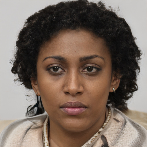 Neutral black young-adult female with short  brown hair and brown eyes