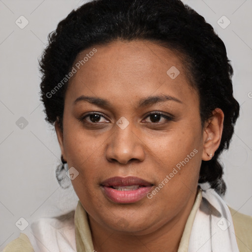 Joyful black adult female with short  brown hair and brown eyes