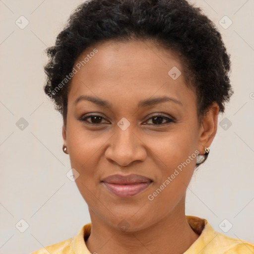 Joyful black young-adult female with short  brown hair and brown eyes