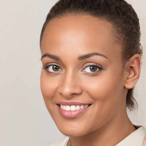 Joyful white young-adult female with short  brown hair and brown eyes