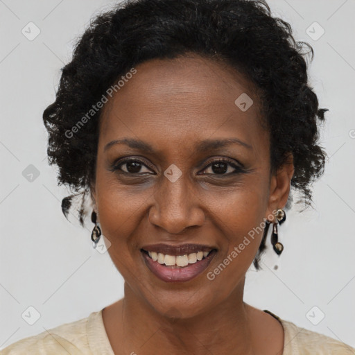 Joyful black adult female with short  brown hair and brown eyes