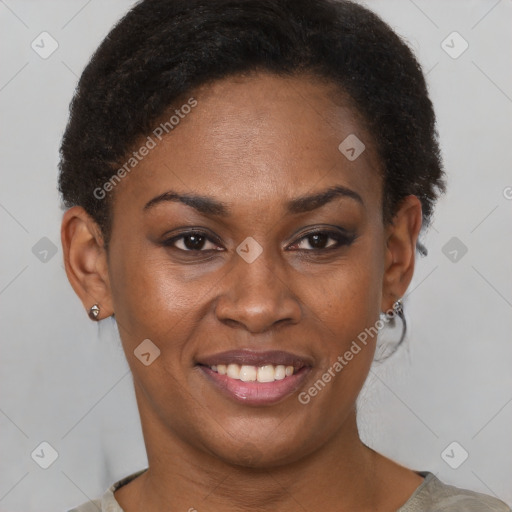 Joyful black young-adult female with short  brown hair and brown eyes