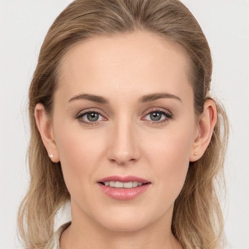 Joyful white young-adult female with long  brown hair and grey eyes