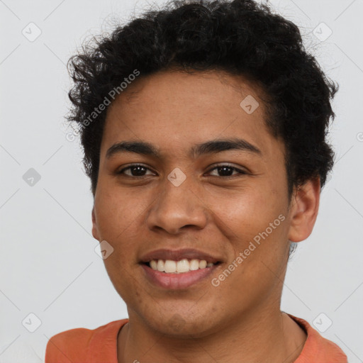 Joyful latino young-adult male with short  brown hair and brown eyes