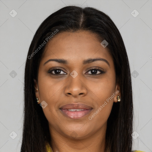 Joyful black young-adult female with long  brown hair and brown eyes