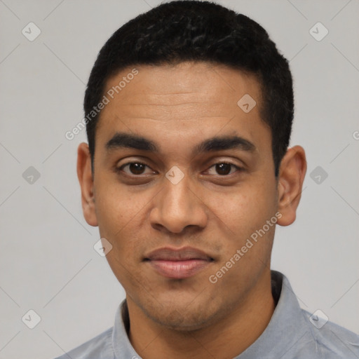 Joyful latino young-adult male with short  black hair and brown eyes