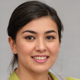 Joyful white young-adult female with medium  brown hair and brown eyes