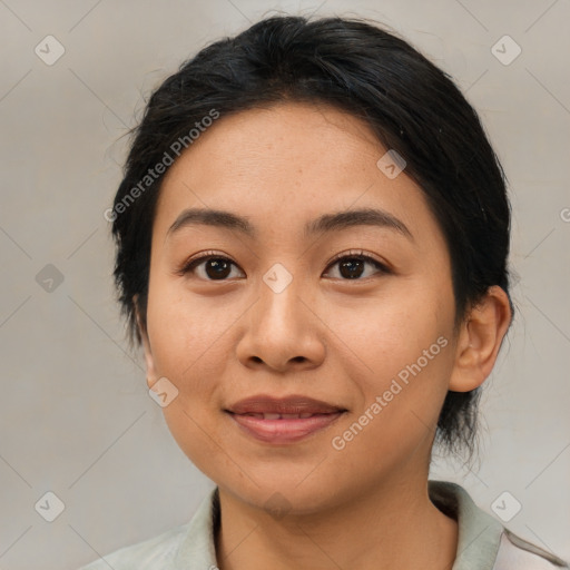 Joyful asian young-adult female with medium  black hair and brown eyes