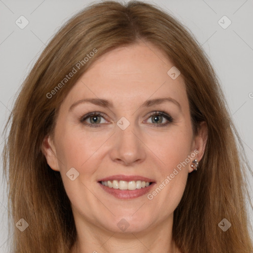 Joyful white adult female with long  brown hair and brown eyes