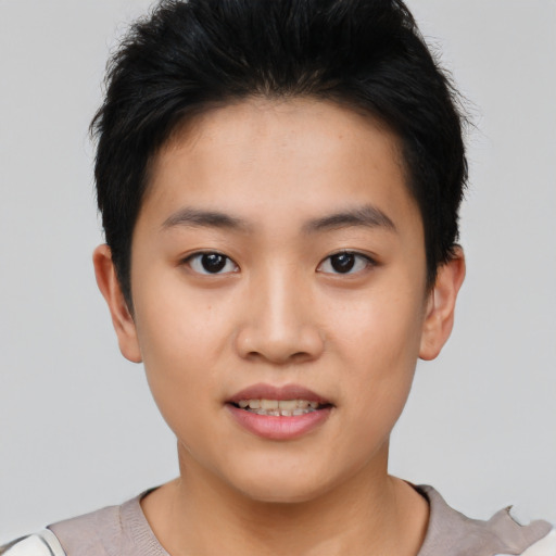 Joyful asian young-adult female with short  black hair and brown eyes