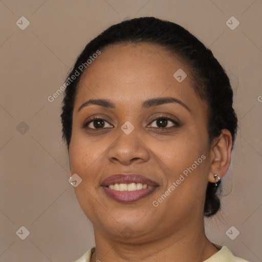 Joyful latino young-adult female with short  brown hair and brown eyes