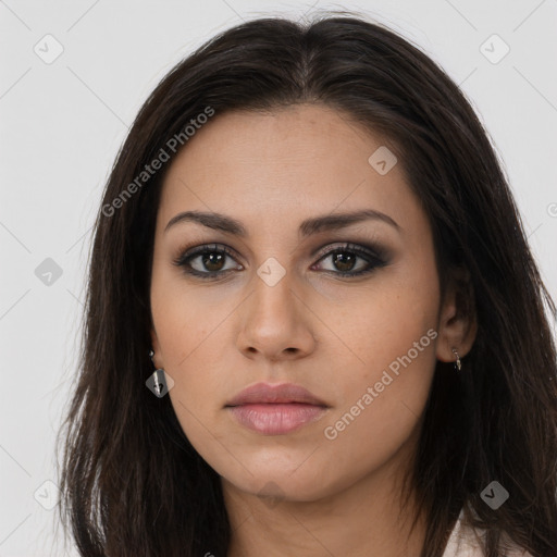 Neutral latino young-adult female with long  brown hair and brown eyes