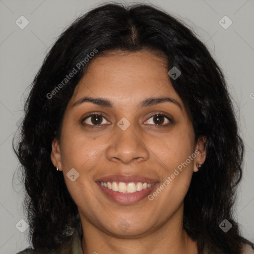 Joyful latino young-adult female with long  brown hair and brown eyes