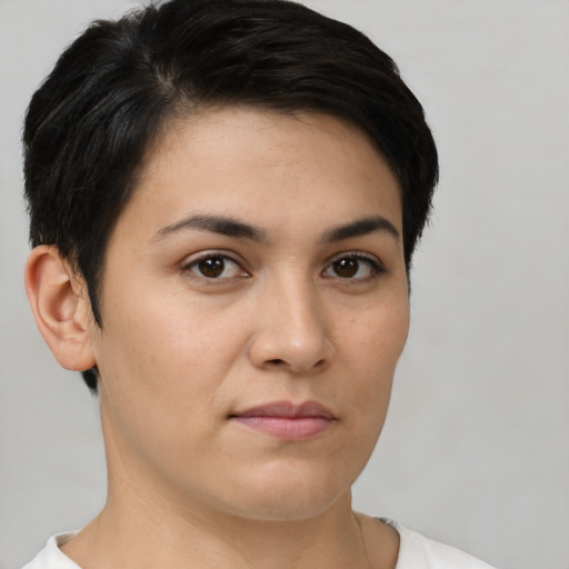 Joyful white young-adult female with short  brown hair and brown eyes