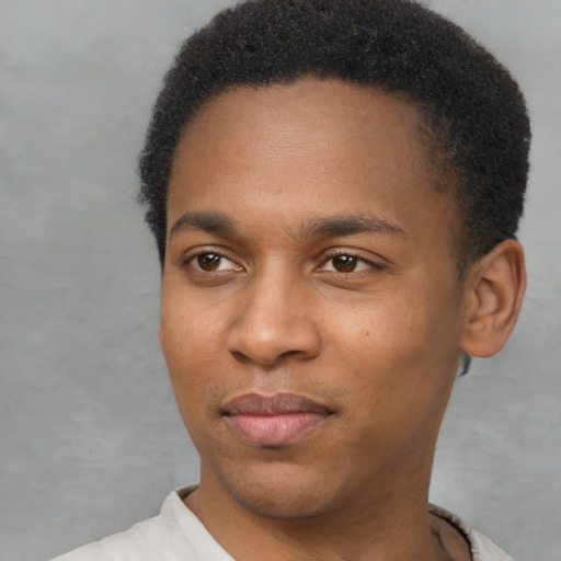 Joyful latino young-adult male with short  brown hair and brown eyes