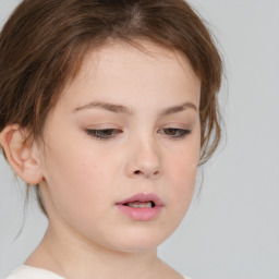 Neutral white child female with medium  brown hair and brown eyes