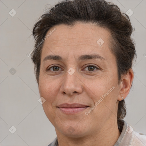 Joyful white adult female with short  brown hair and brown eyes